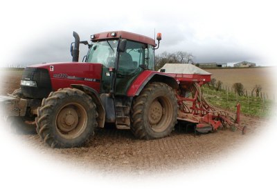 Photo of case tractor with seed drill